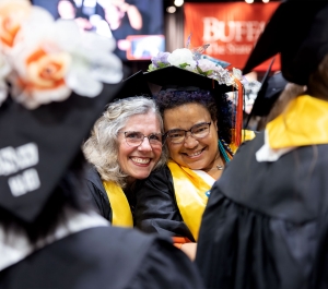 Smiling commencement students